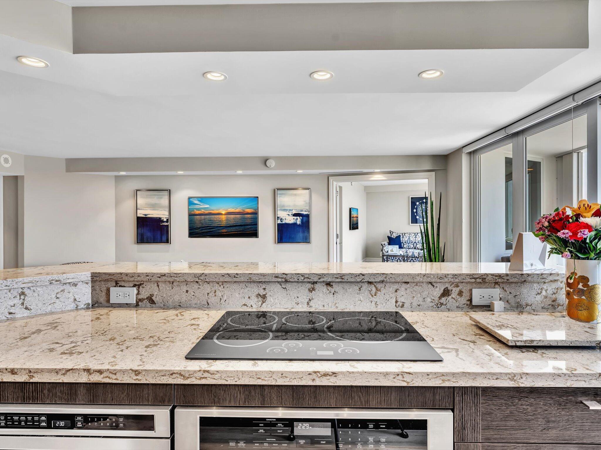 500 South Ocean Boulevard, Unit 909 Boca Raton, FL 33432 - Photo 23 of 101 a bathroom with a granite countertop sink and a mirror