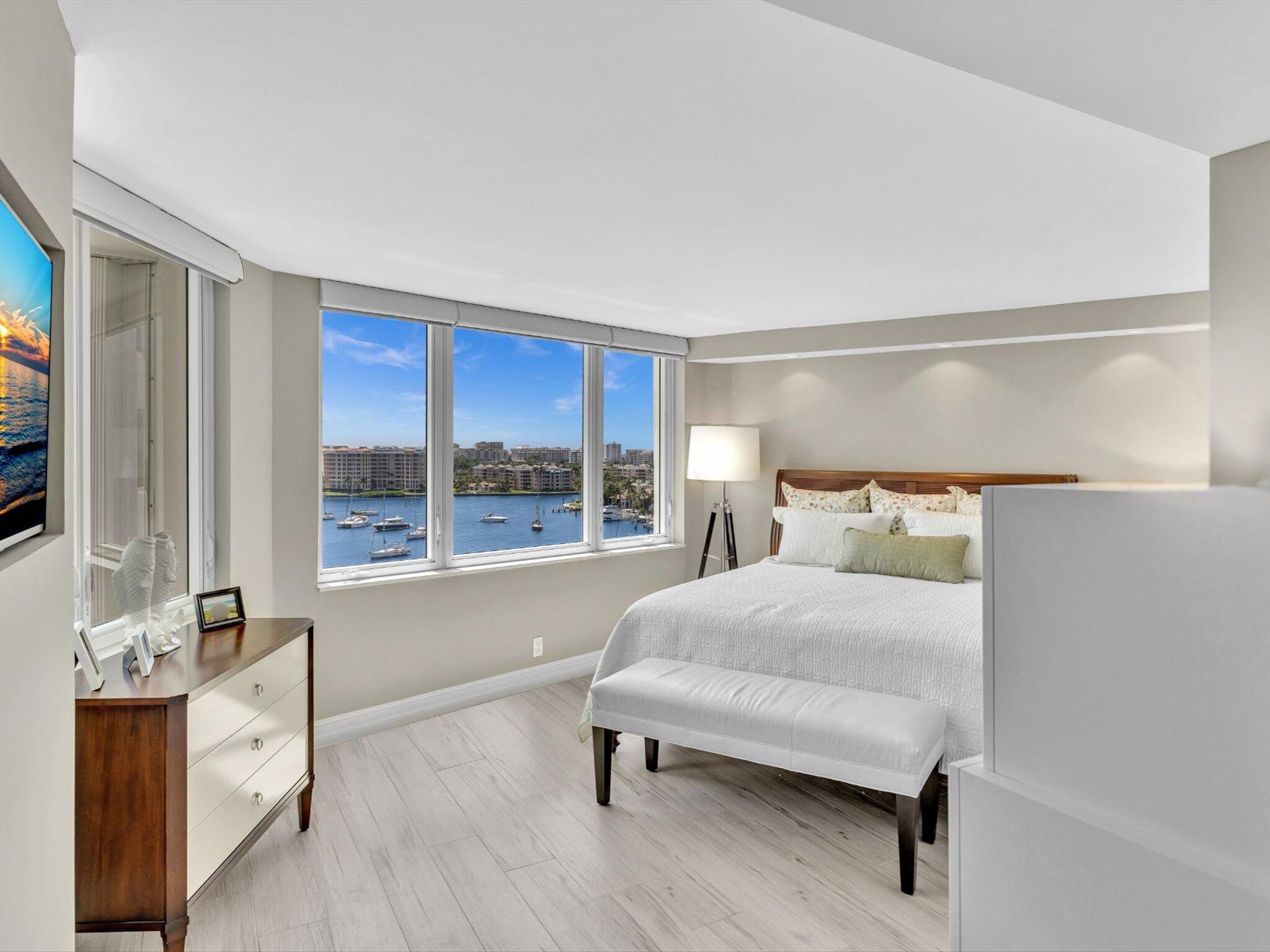 500 South Ocean Boulevard, Unit 909 Boca Raton, FL 33432 - Photo 27 of 101 a bedroom with a large bed and a window