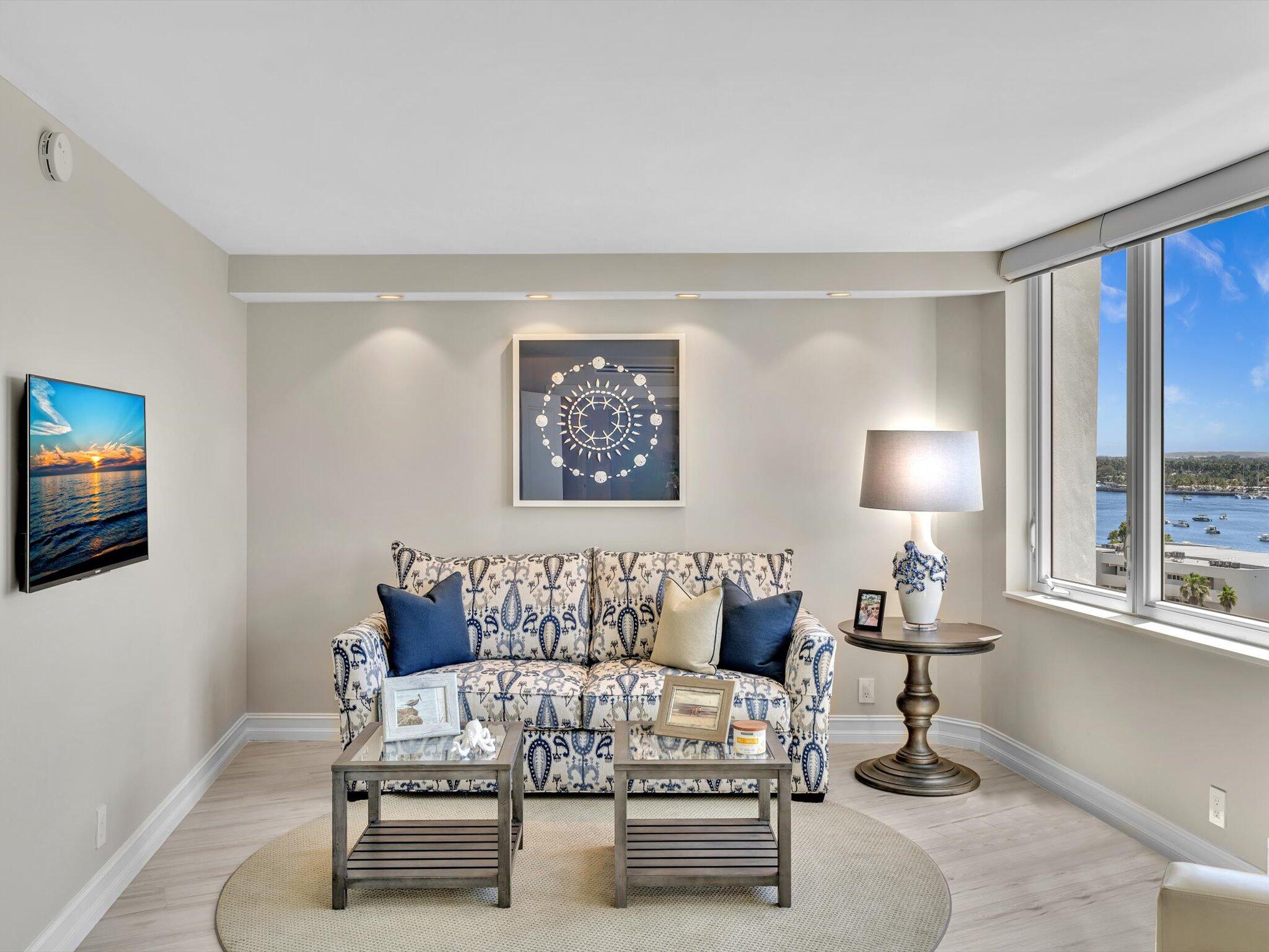 500 South Ocean Boulevard, Unit 909 Boca Raton, FL 33432 - Photo 35 of 101 a living room with furniture wooden floor and a lamp