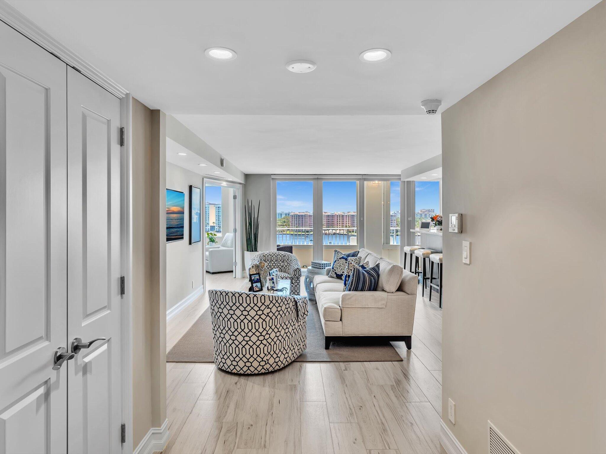 500 South Ocean Boulevard, Unit 909 Boca Raton, FL 33432 - Photo 4 of 101 a living room with furniture and a wooden floor