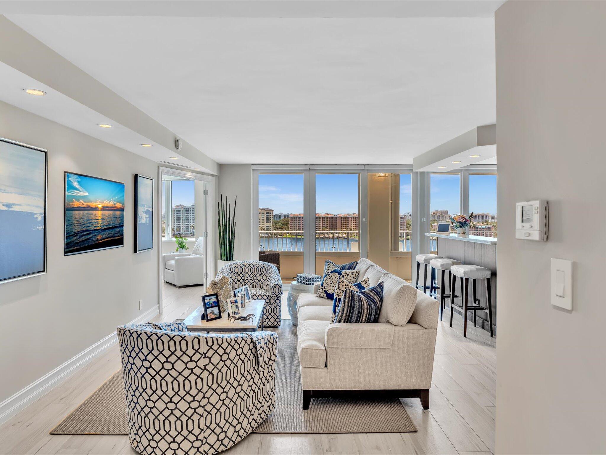 500 South Ocean Boulevard, Unit 909 Boca Raton, FL 33432 - Photo 5 of 101 a living room with furniture and a flat screen tv
