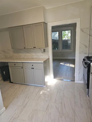 a view of a kitchen with a sink and a cabinets