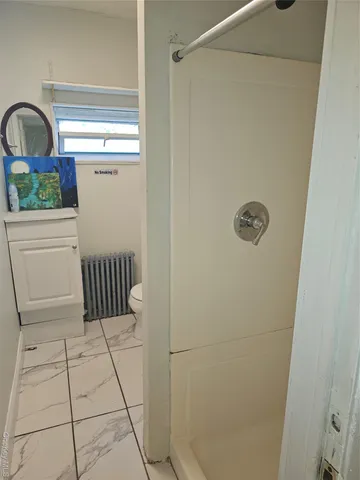 a bathroom with a sink and vanity