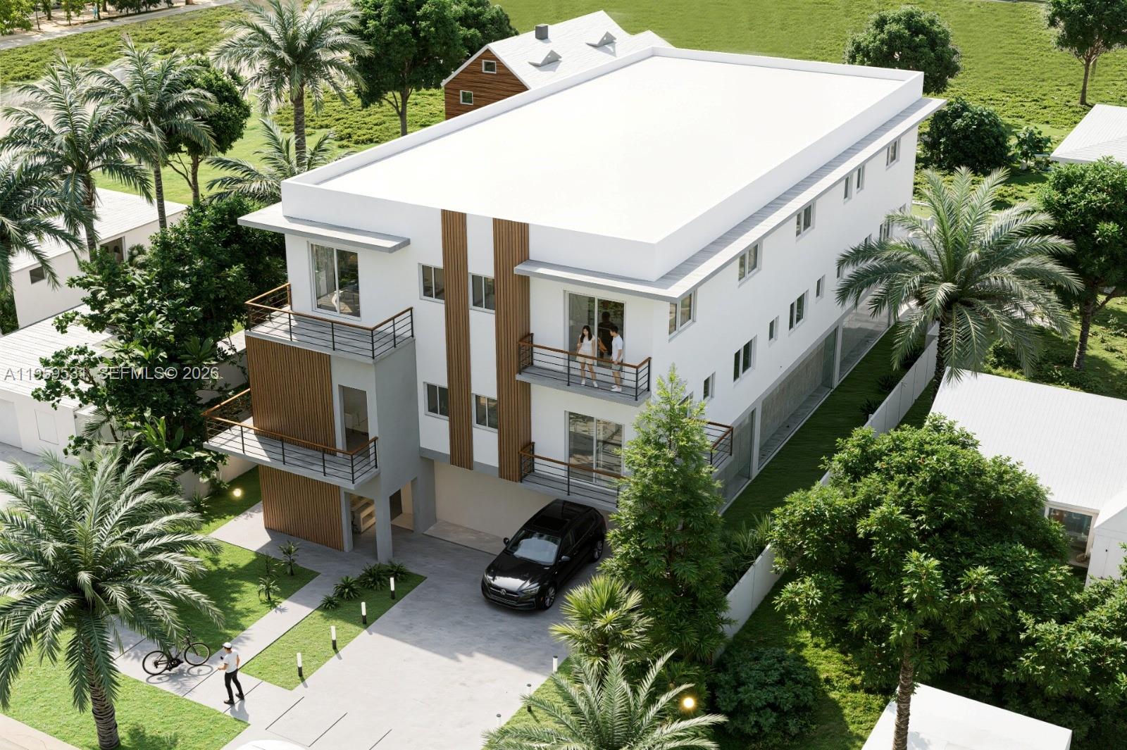 1949 Harding Street Hollywood, FL 33020 - Photo 2 of 3 a view of a white house with a large windows and plants