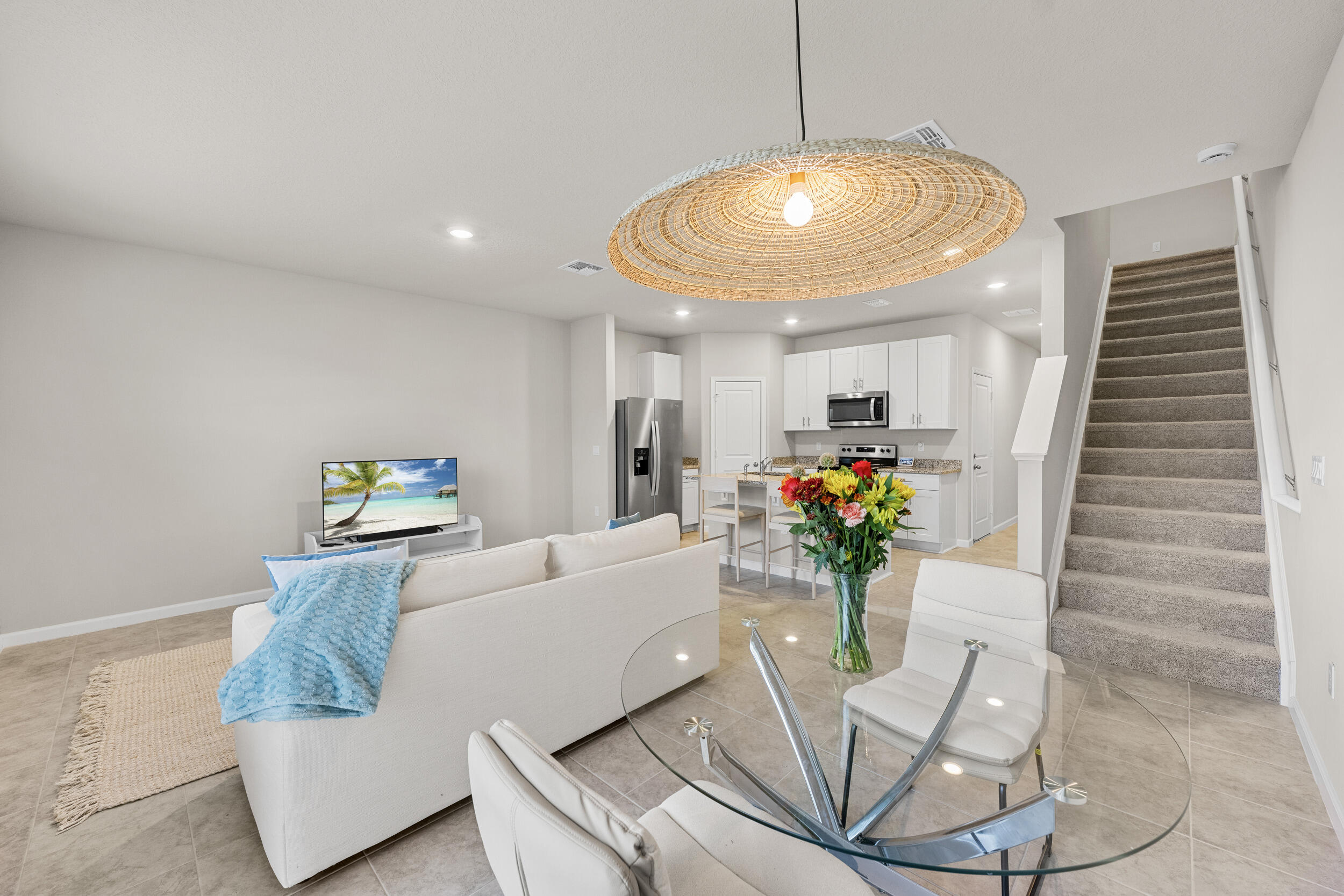 5731 Southeast Edgewater Circle Stuart, FL 34997 - Photo 17 of 42 a living room with furniture and flowers