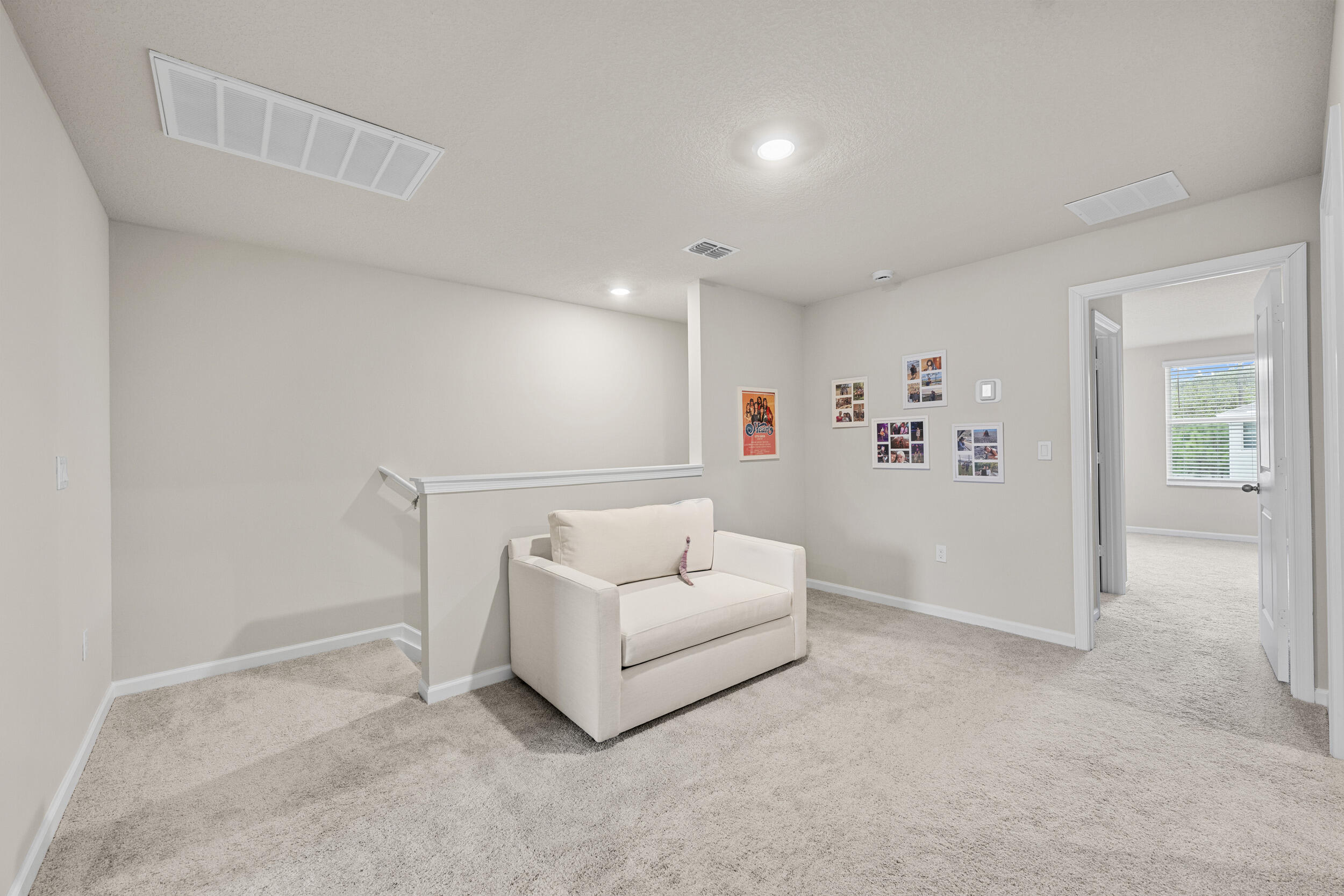 5731 Southeast Edgewater Circle Stuart, FL 34997 - Photo 21 of 42 a living room with furniture and white wall painting