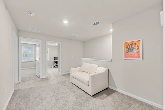 a spacious bedroom with a bed and a couch