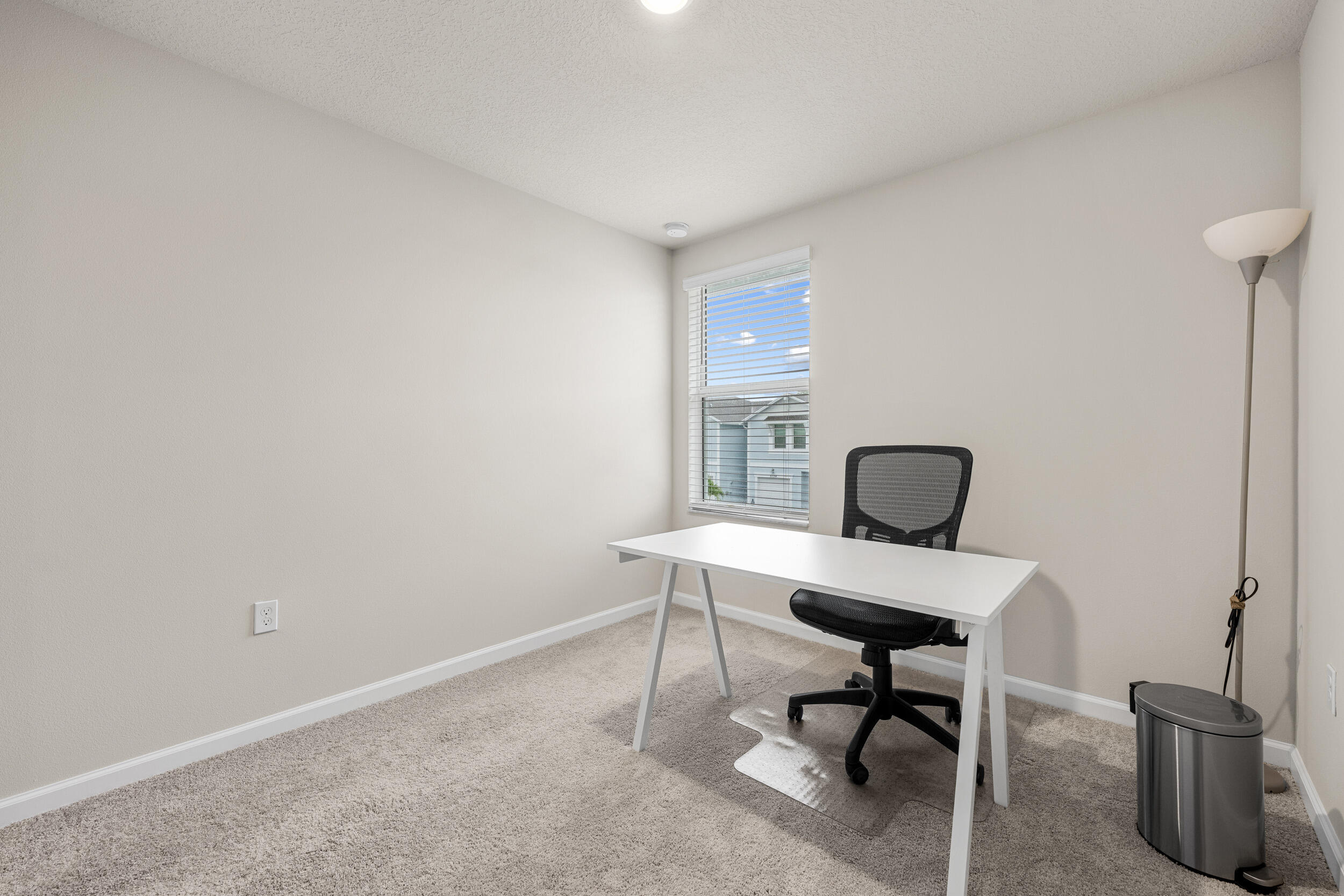 5731 Southeast Edgewater Circle Stuart, FL 34997 - Photo 24 of 42 a workspace with furniture and a window
