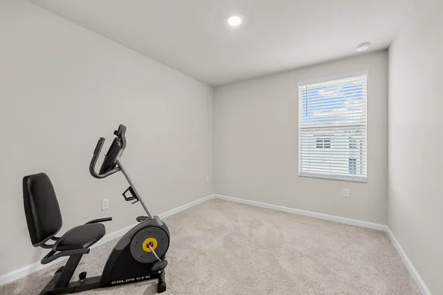 a view of room with gym equipment