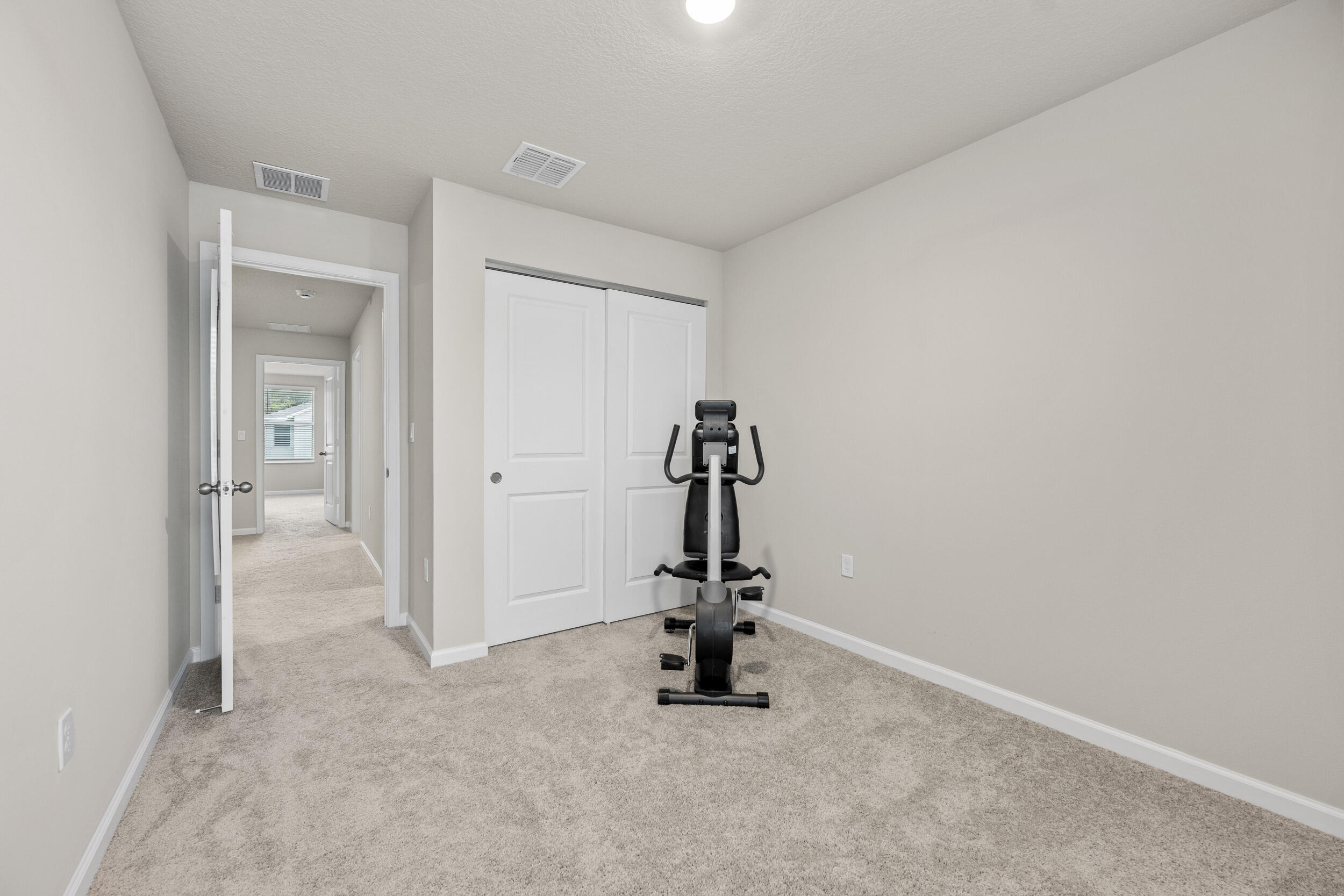 5731 Southeast Edgewater Circle Stuart, FL 34997 - Photo 27 of 42 a view of a room with gym equipment