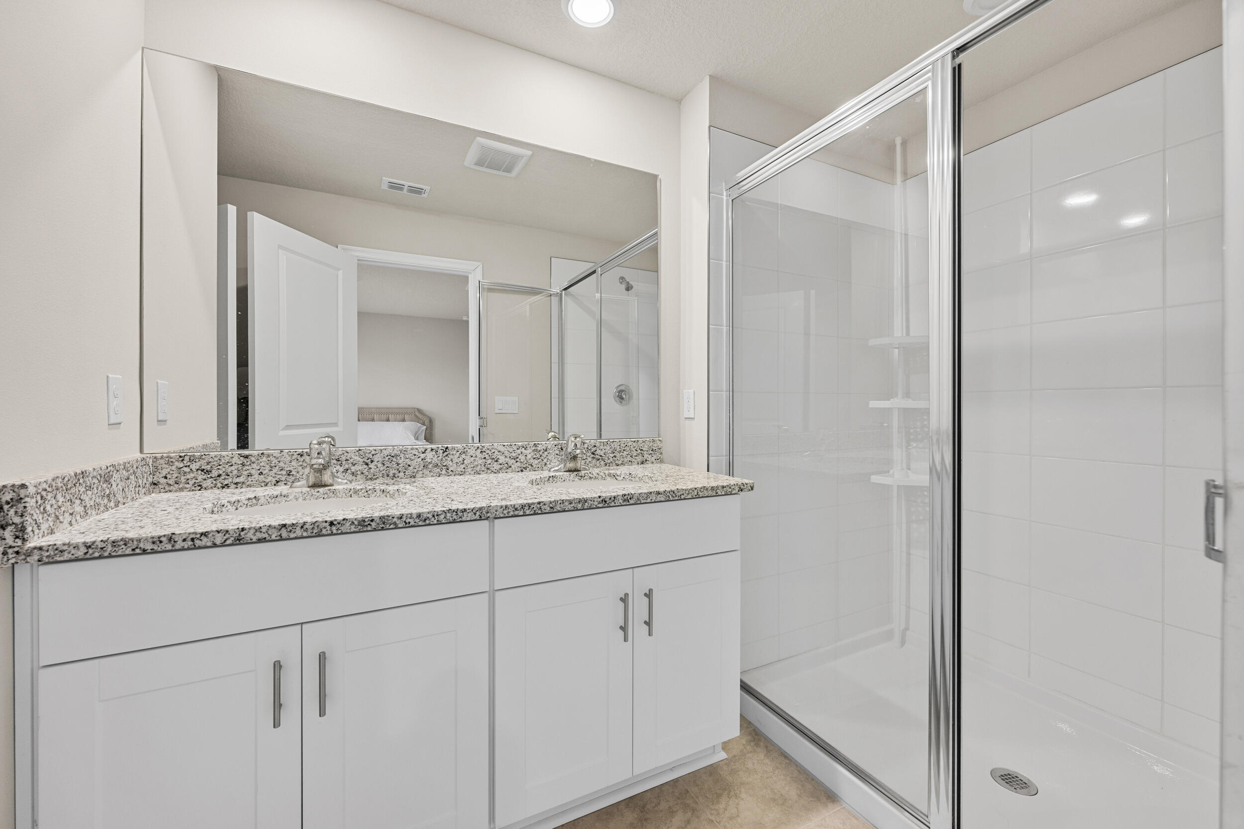 5731 Southeast Edgewater Circle Stuart, FL 34997 - Photo 34 of 42 a bathroom with a granite countertop sink and a mirror