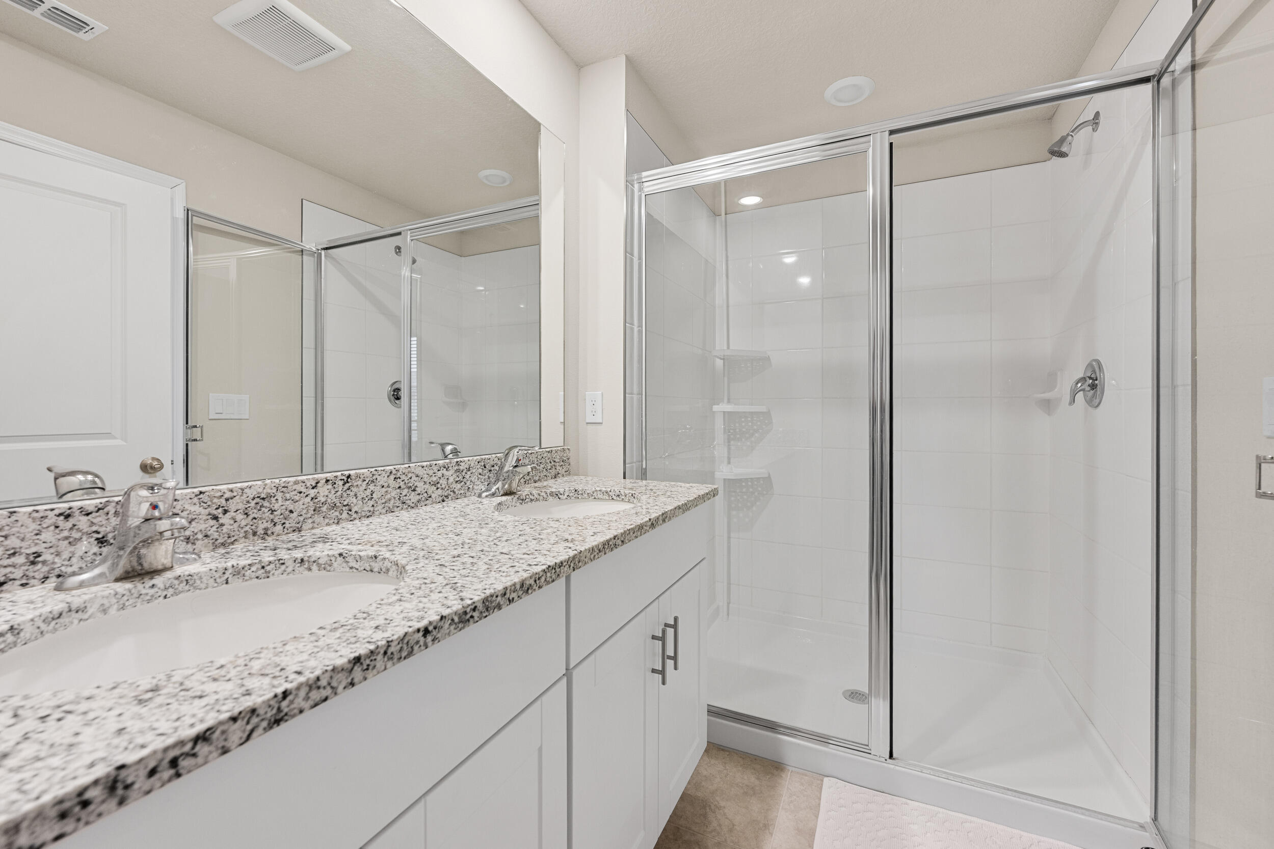 5731 Southeast Edgewater Circle Stuart, FL 34997 - Photo 35 of 42 a bathroom with a granite countertop sink and a mirror