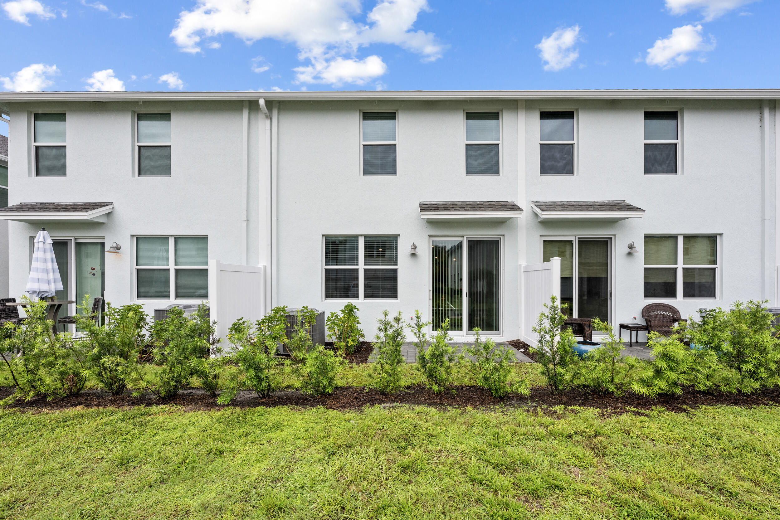 5731 Southeast Edgewater Circle Stuart, FL 34997 - Photo 38 of 42 a front view of a house with a yard