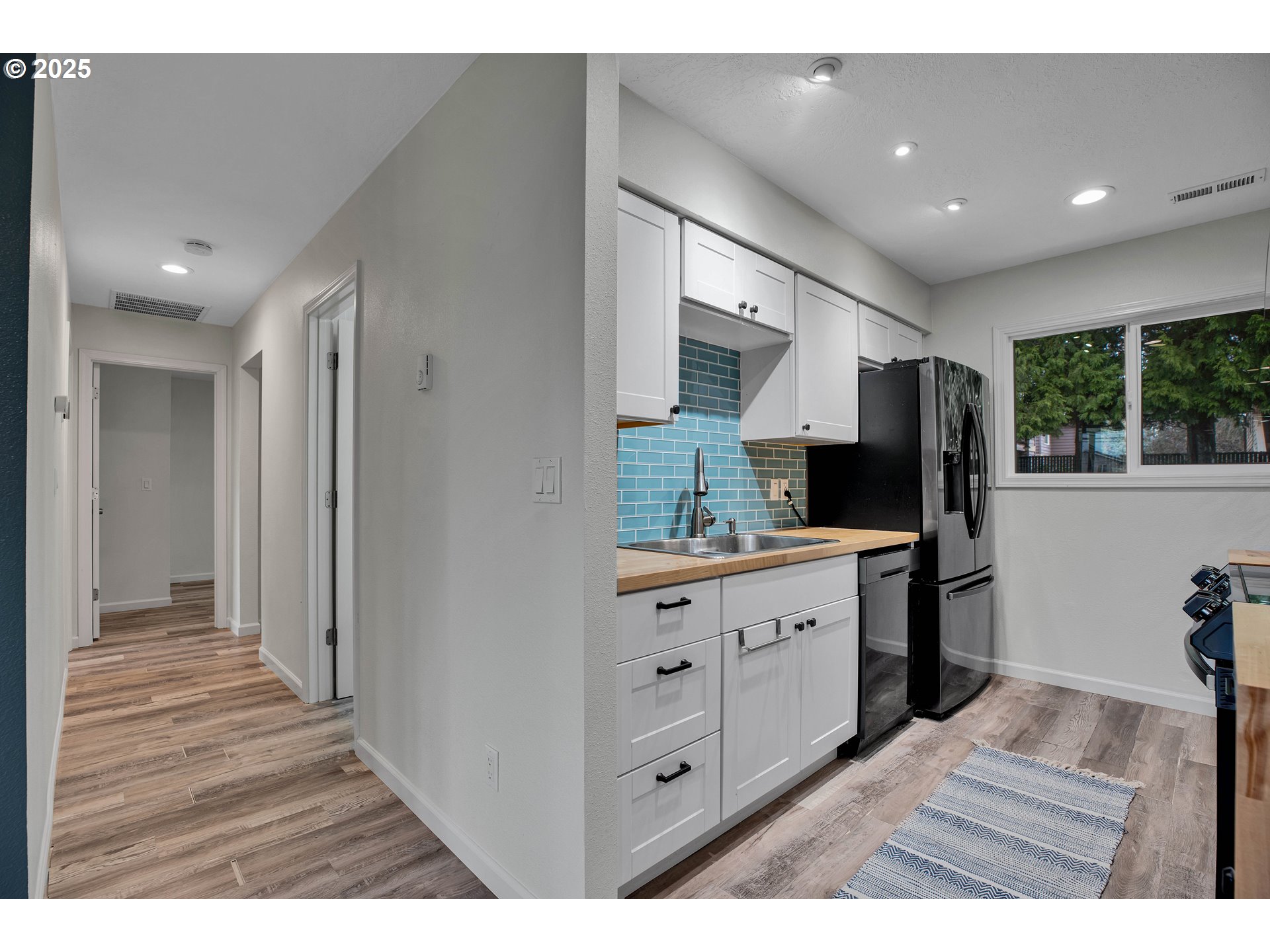 700 Southeast Hogan Road Gresham, OR 97080 - Photo 24 of 37 a bathroom with a sink a mirror and a toilet