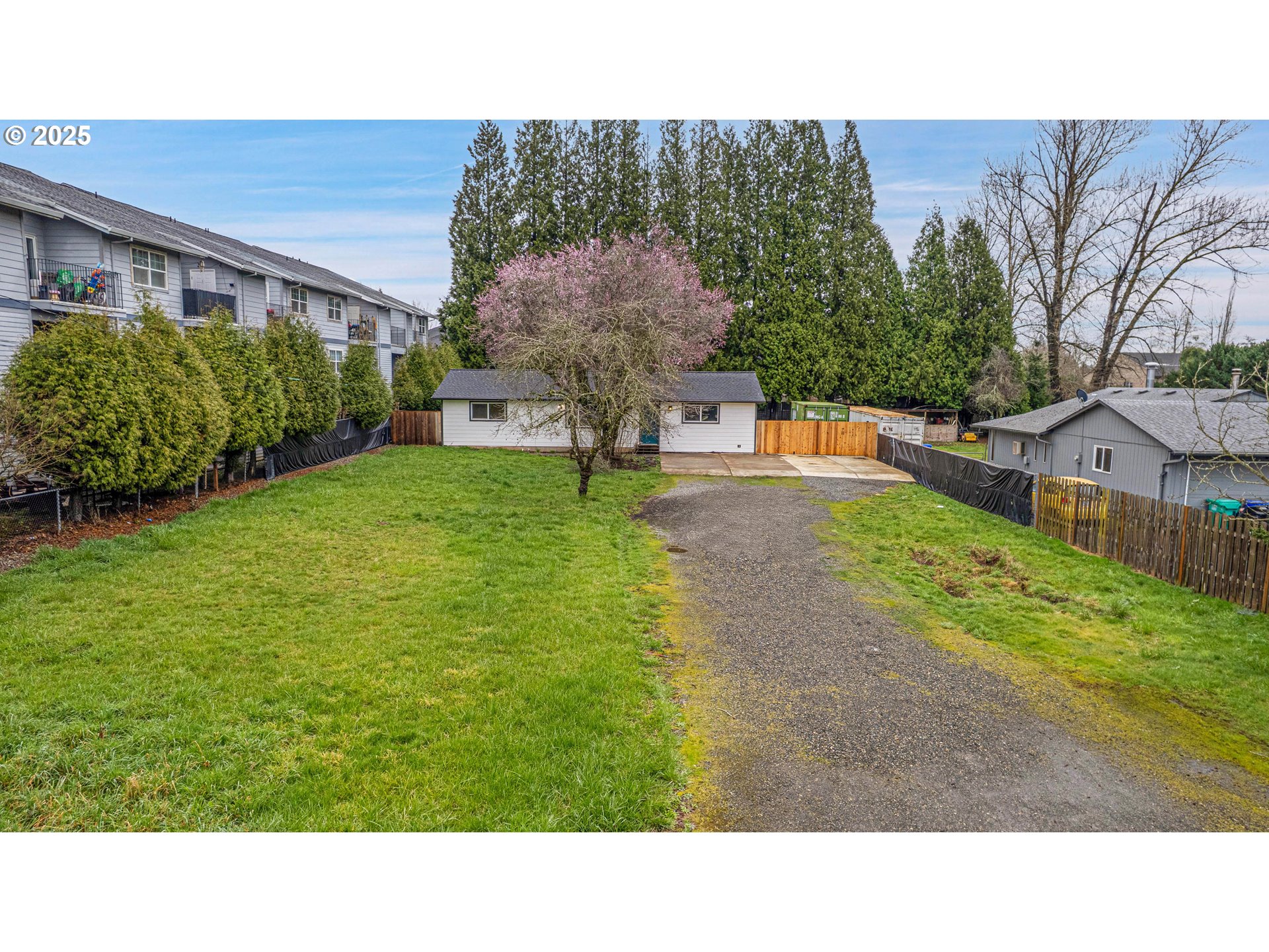 700 Southeast Hogan Road Gresham, OR 97080 - Photo 3 of 37 a black and white photo of a house