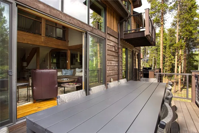a view of a chairs and table in the balcony