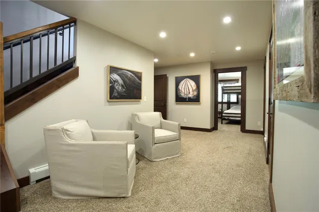 a living room with furniture and large window