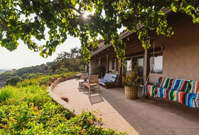 a view of balcony with wooden floor