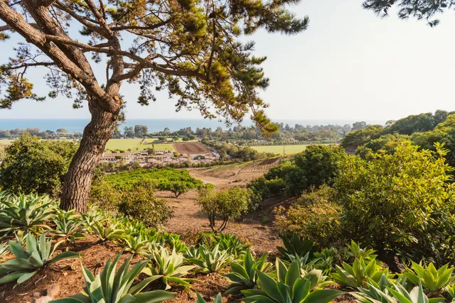 an outdoor space with furniture and city view