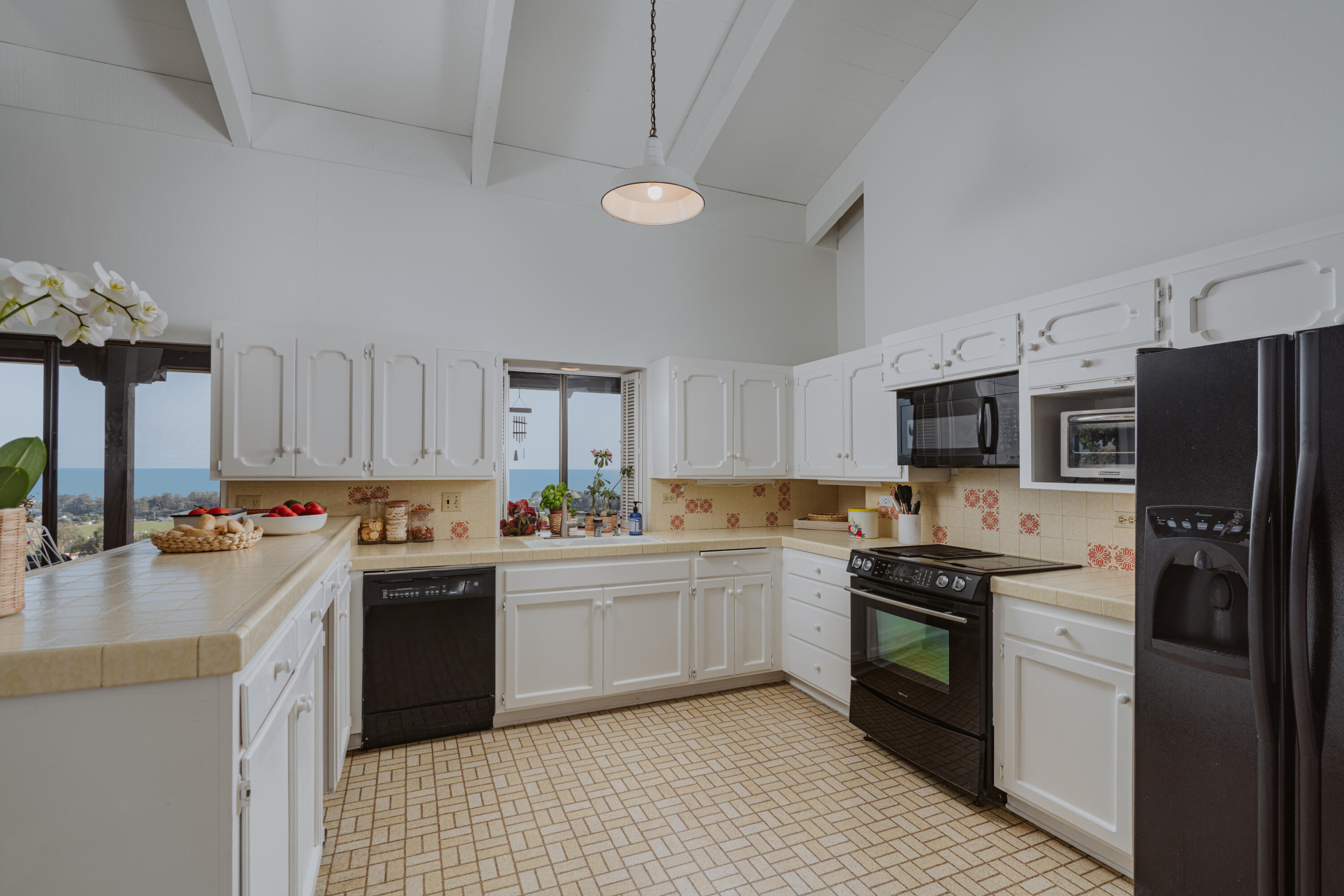 3330 Foothill Road Carpinteria, CA 93013 - Photo 27 of 56 a kitchen with a sink stove and refrigerator