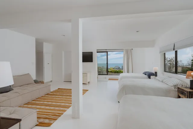 a bedroom with furniture and a fireplace