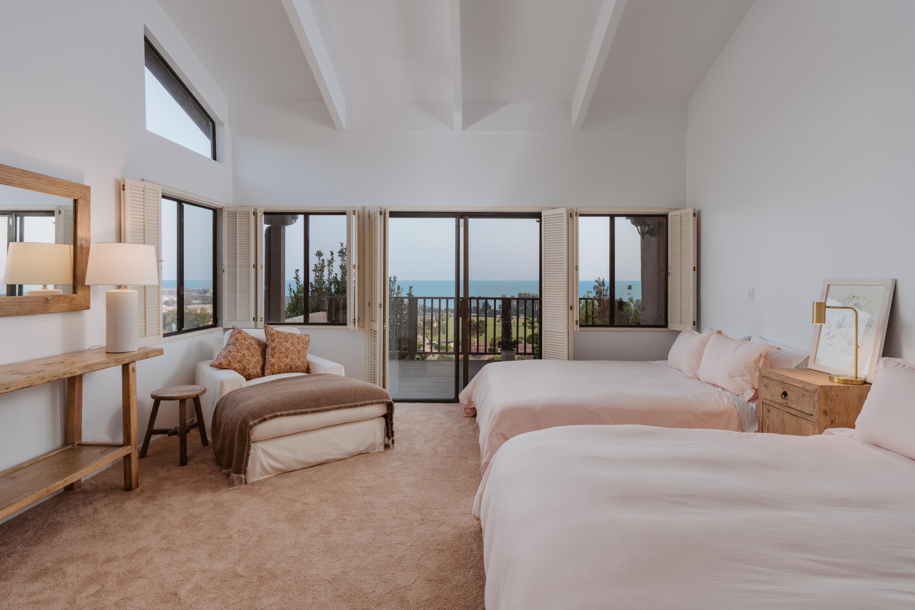 3330 Foothill Road Carpinteria, CA 93013 - Photo 33 of 56 a spacious bedroom with a bed couch and a large window