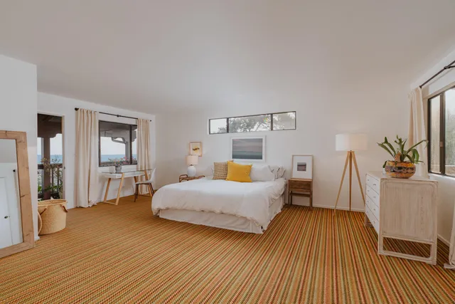 a spacious bathroom with a bathtub sink and mirror