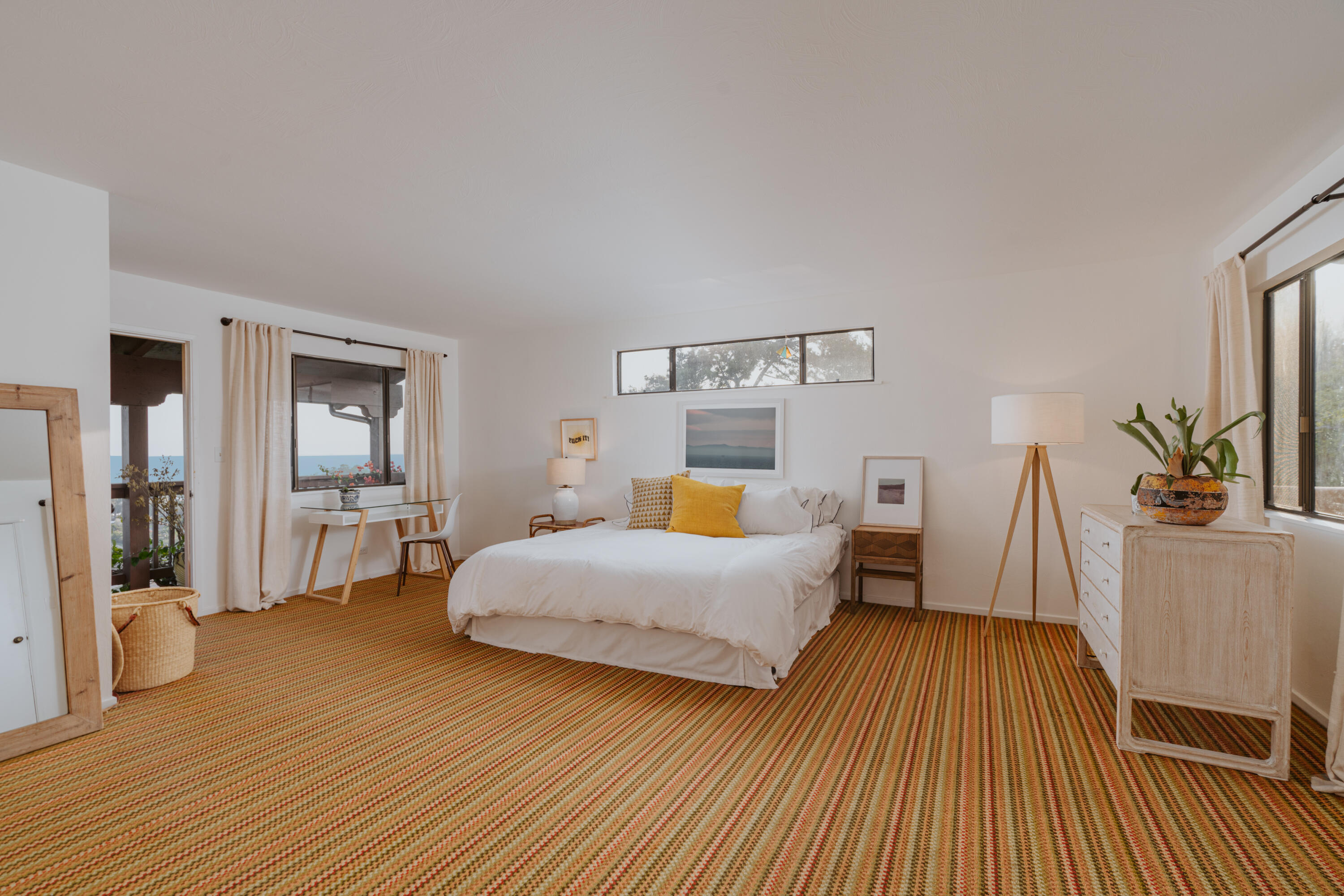 3330 Foothill Road Carpinteria, CA 93013 - Photo 41 of 56 a bedroom with a bed and wooden floor