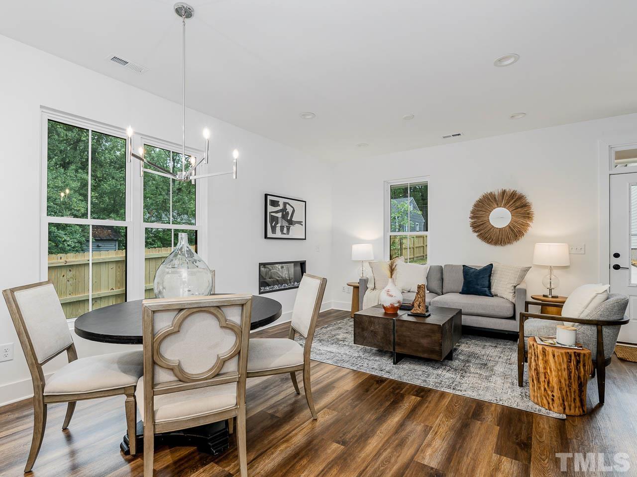 614 East Ellerbee Street Durham, NC 27704 - Photo 11 of 28 a living room with furniture and a large window