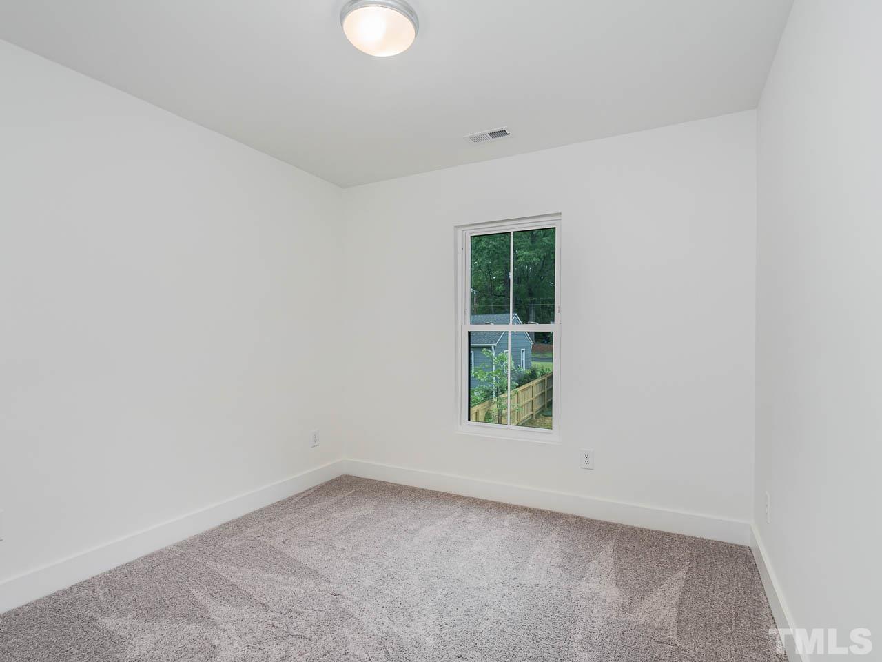614 East Ellerbee Street Durham, NC 27704 - Photo 22 of 28 an empty room with a window