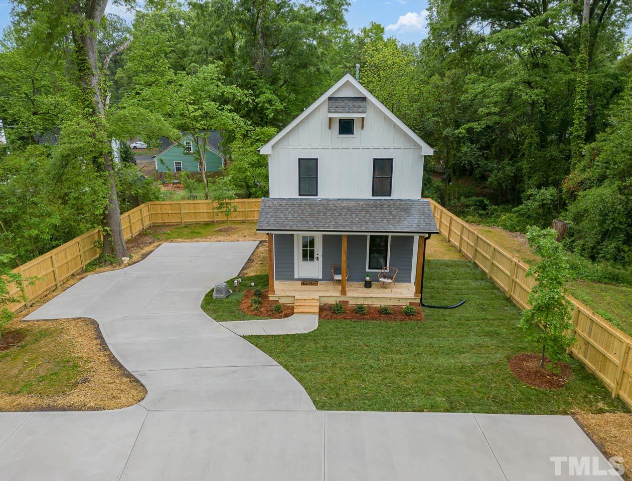 614 East Ellerbee Street Durham, NC 27704 - Photo 3 of 28 a front view of a house with garden