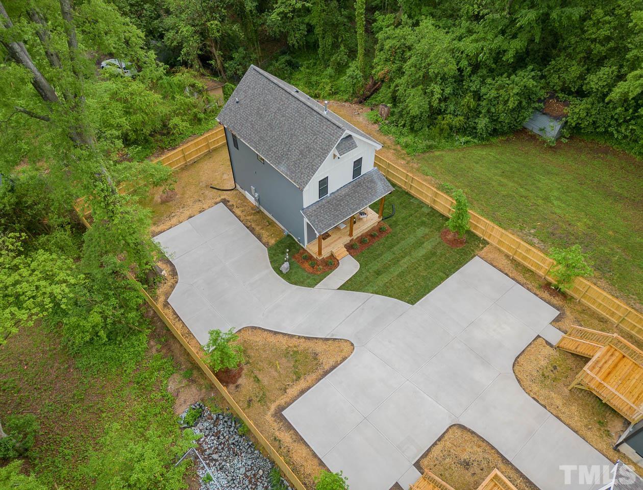 614 East Ellerbee Street Durham, NC 27704 - Photo 8 of 28 an aerial view of a house with a garden and swimming pool