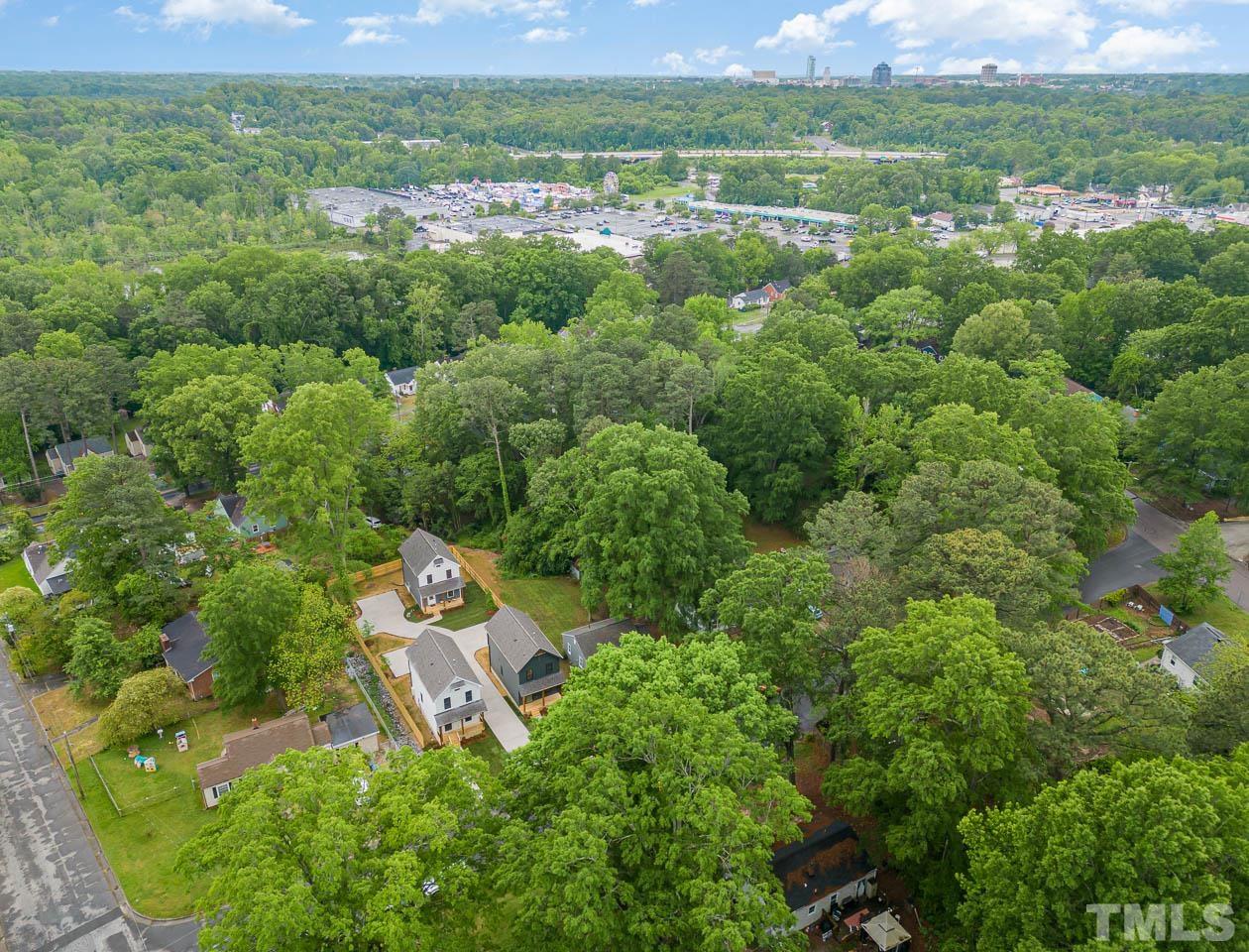 614 East Ellerbee Street Durham, NC 27704 - Photo 9 of 28 an aerial view of residential houses with outdoor space and trees