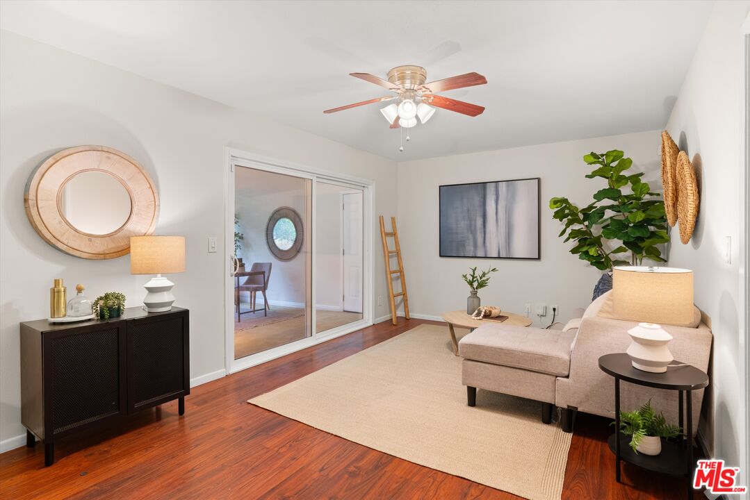1407 East Kramer Drive Carson, CA 90746 - Photo 11 of 24 a living room with furniture a window and a lamp