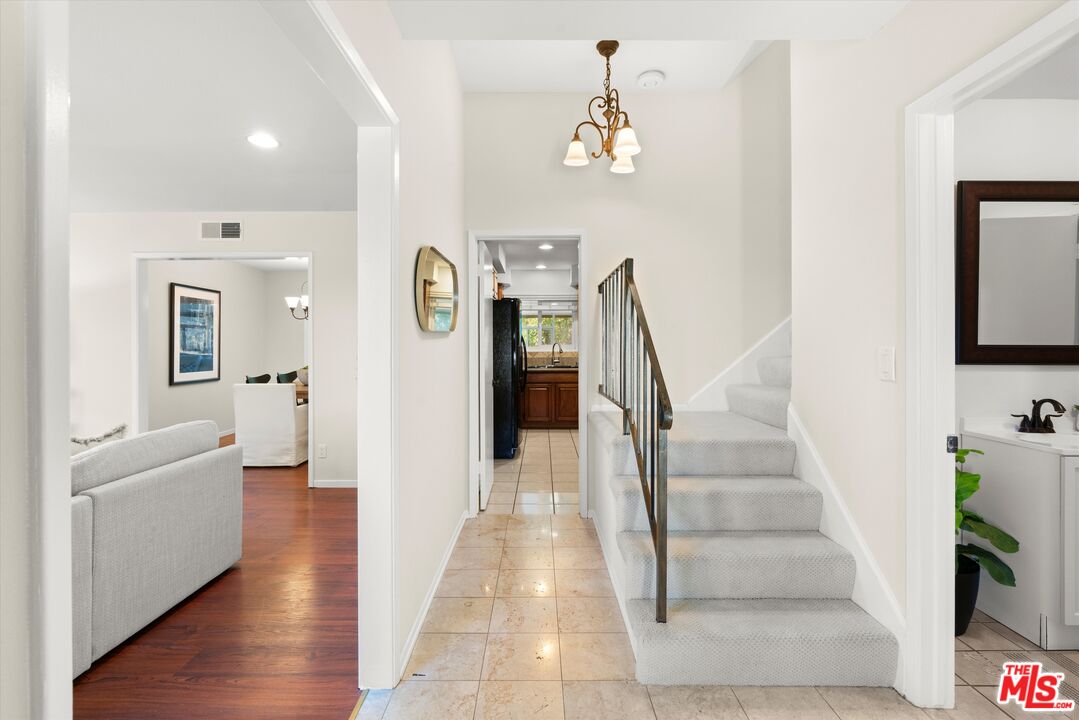 1407 East Kramer Drive Carson, CA 90746 - Photo 12 of 24 a view of entryway and hall with wooden floor