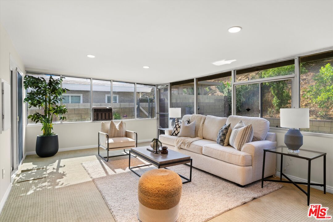 1407 East Kramer Drive Carson, CA 90746 - Photo 23 of 24 a living room with furniture and a large window