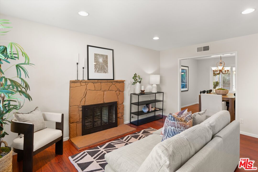 1407 East Kramer Drive Carson, CA 90746 - Photo 4 of 24 a living room with furniture and a fireplace