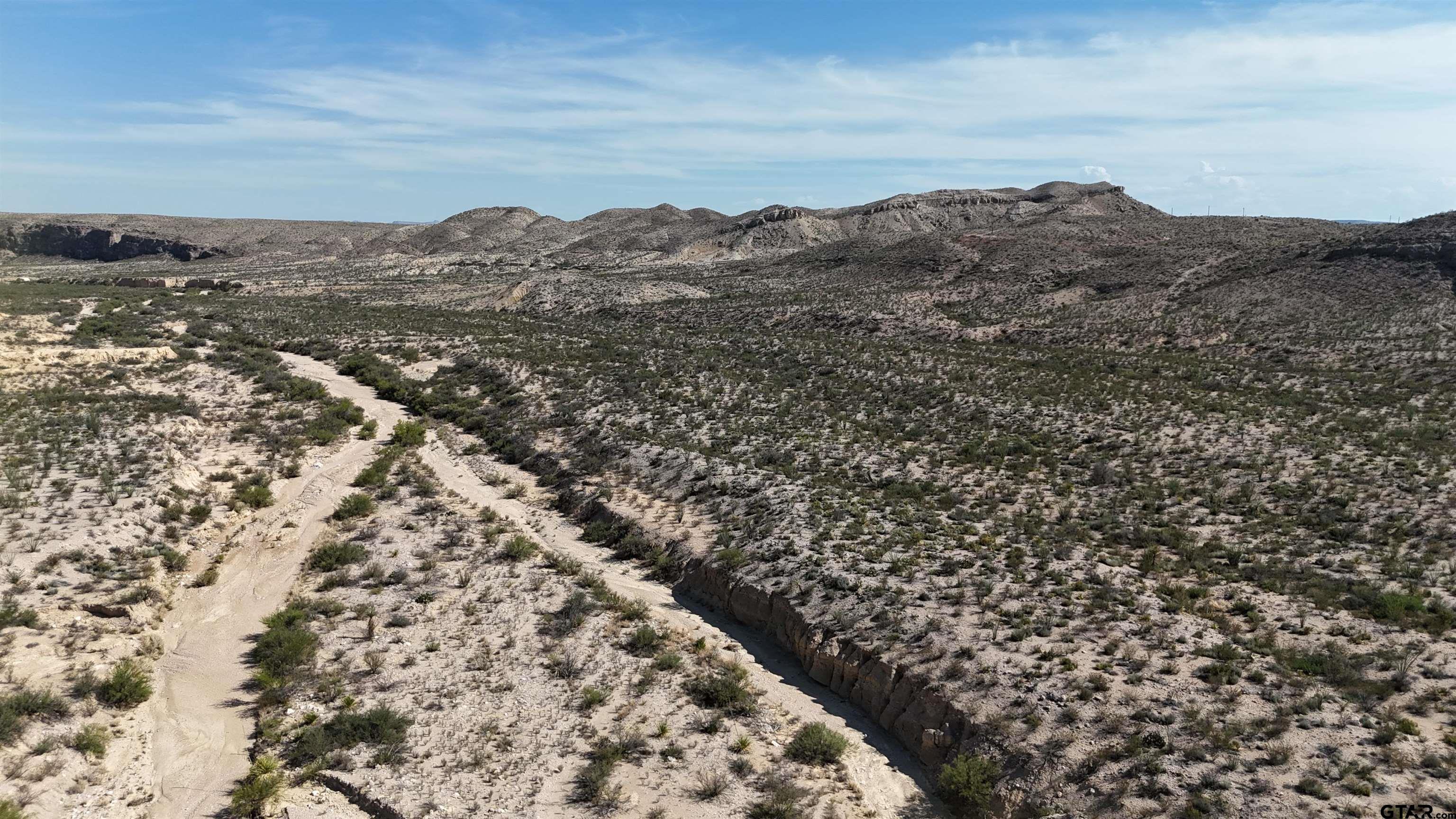 26885 Long Draw Terlingua, TX 79852 - Photo 4 of 28 an aerial view of houses covered with snow in all around