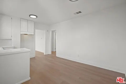 a view of a storage & utility room with a sink