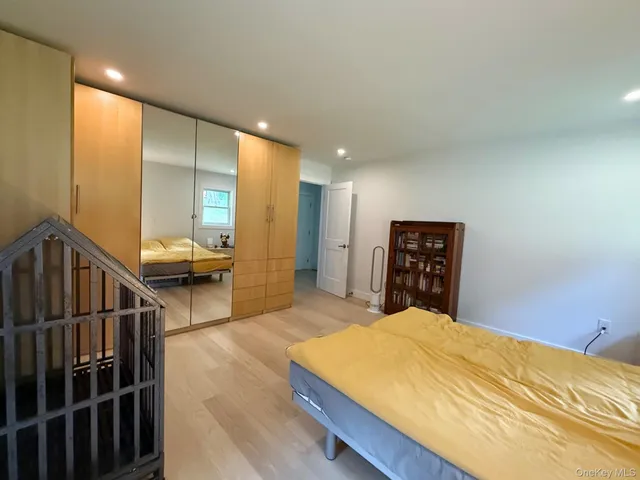 a bed room with a bed and a television