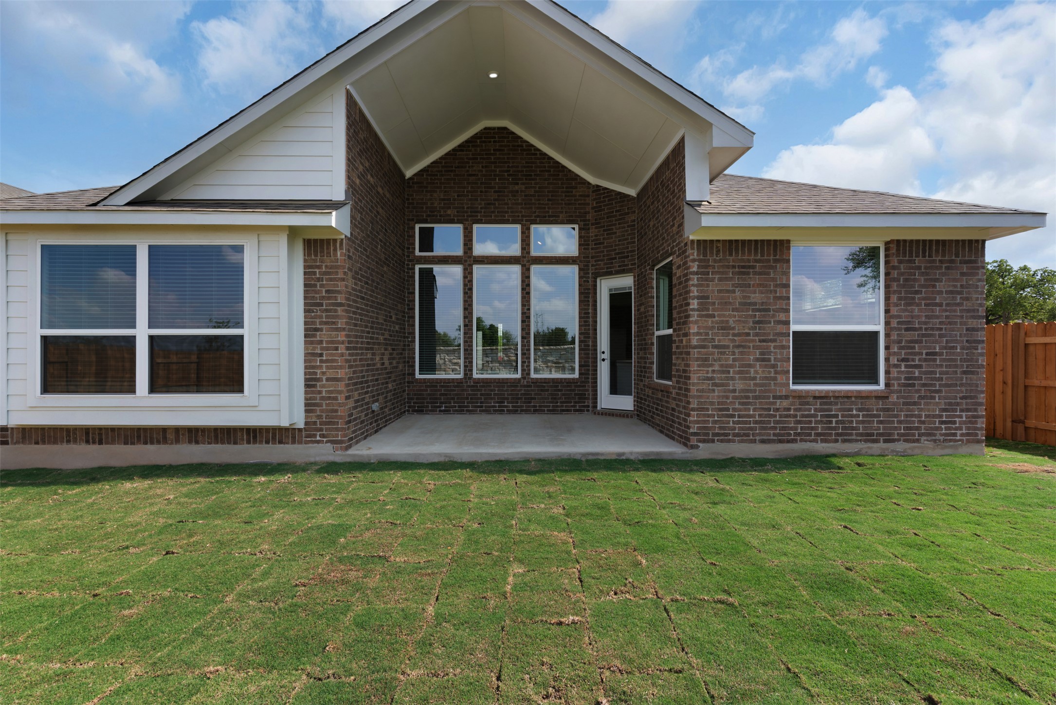 1121 Pansy Trail Georgetown, TX 78628 - Photo 16 of 25 Rear view of house featuring brick siding and a patio area