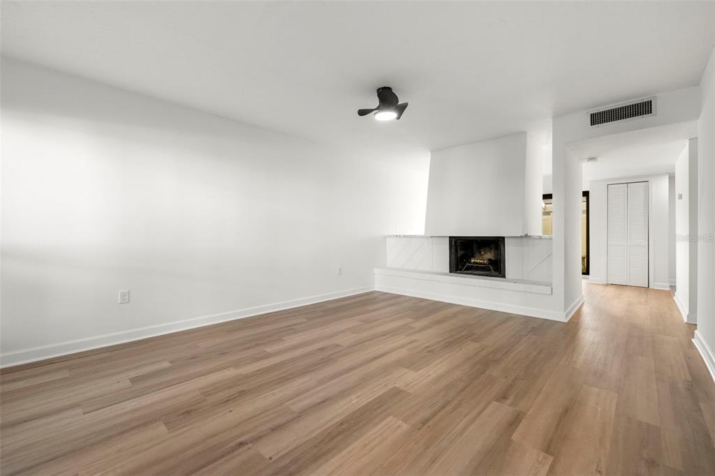 1 Windrush Boulevard, Unit 19 Indian Rocks Beach, FL 33785 - Photo 12 of 52 a view of empty room with wooden floor