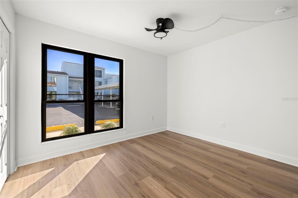 1 Windrush Boulevard, Unit 19 Indian Rocks Beach, FL 33785 - Photo 21 of 52 a view of an empty room with a window