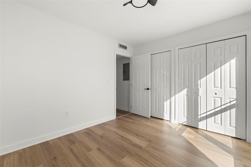 1 Windrush Boulevard, Unit 19 Indian Rocks Beach, FL 33785 - Photo 23 of 52 a view of an empty room with wooden floor