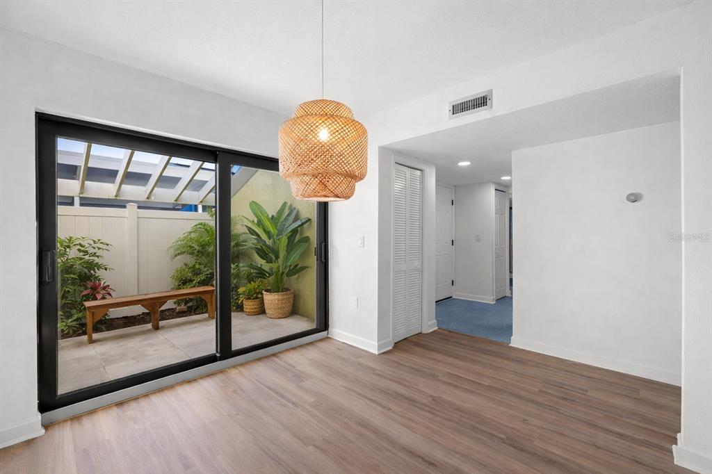 1 Windrush Boulevard, Unit 19 Indian Rocks Beach, FL 33785 - Photo 7 of 52 a view of an entryway door and wooden floor