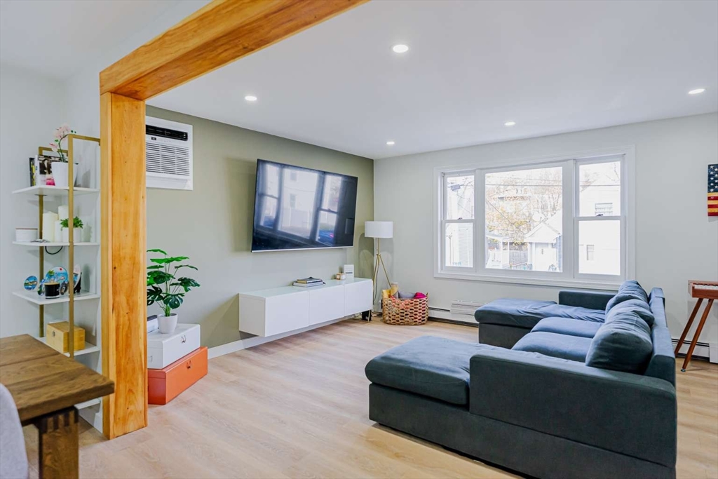 27 Silver Road, Unit 27 Everett, MA 02149 - Photo 13 of 42 a living room with furniture and a flat screen tv