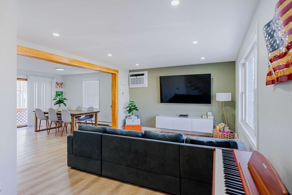 27 Silver Road, Unit 27 Everett, MA 02149 - Photo 14 of 42 a living room with furniture and a flat screen tv