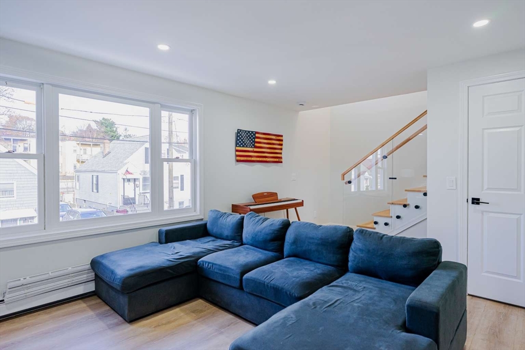 27 Silver Road, Unit 27 Everett, MA 02149 - Photo 16 of 42 a living room with furniture and a large window