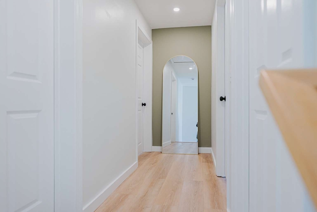 27 Silver Road, Unit 27 Everett, MA 02149 - Photo 22 of 42 a view of a hallway with wooden floor