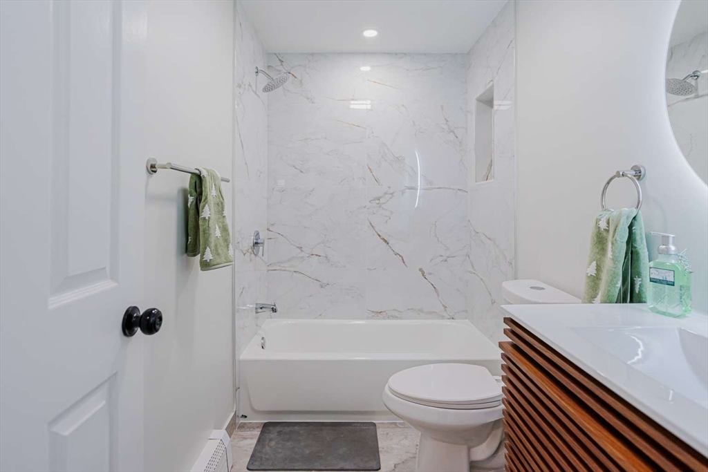 27 Silver Road, Unit 27 Everett, MA 02149 - Photo 26 of 42 a bathroom with a sink a toilet and shower